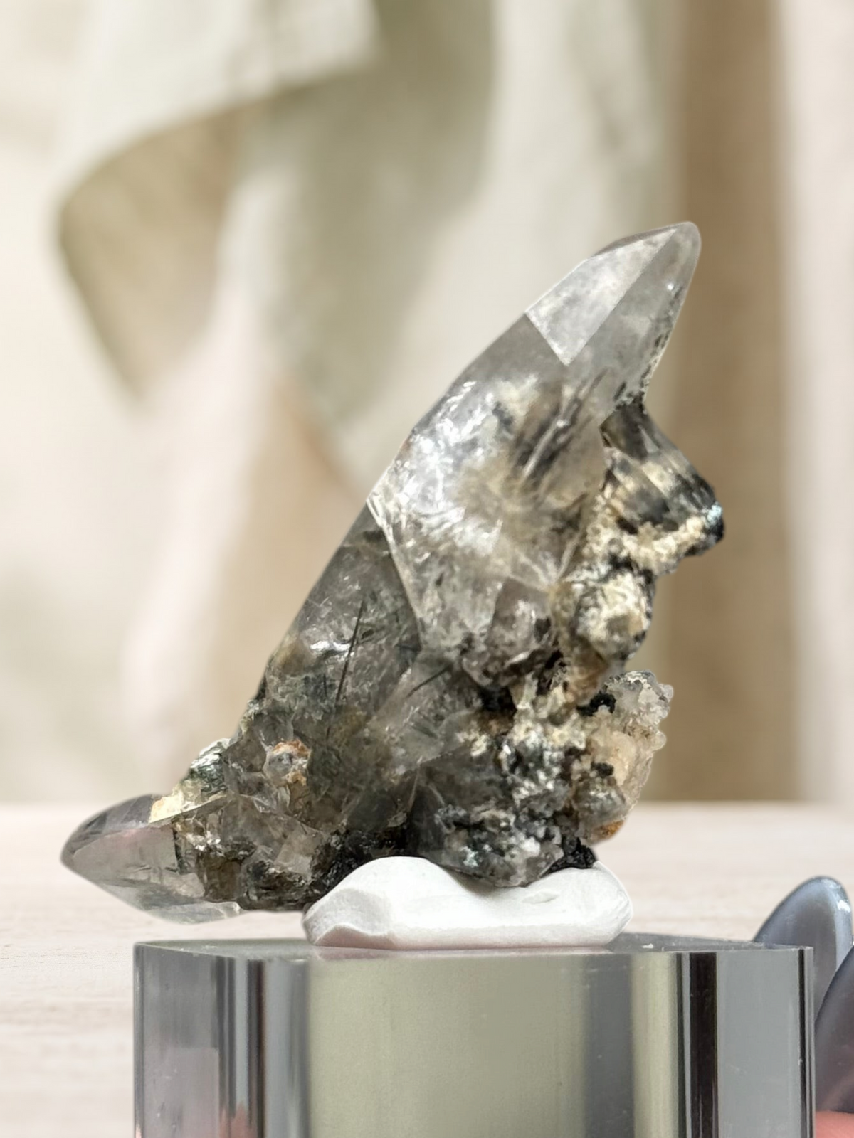 Crystal Glade laser quartz specimen from Balochistan, Pakistan, featuring a long, slender, tapering clear crystal.