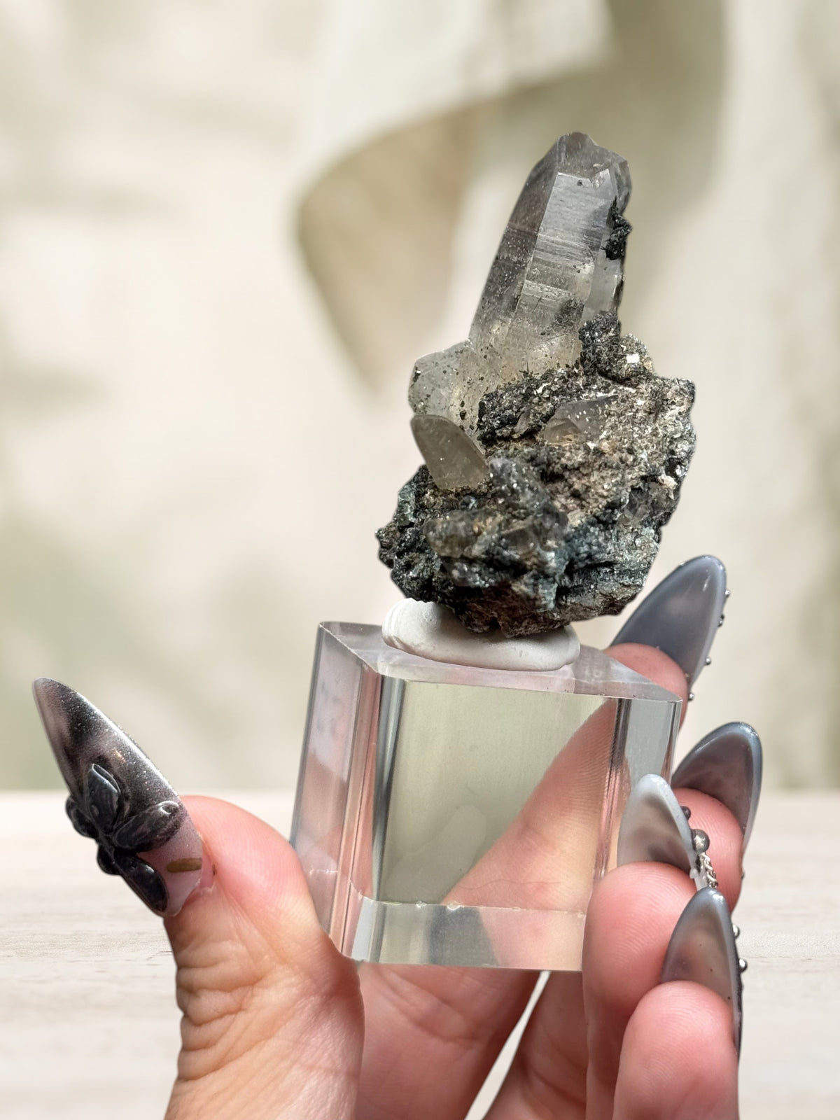 Crystal Glade laser quartz specimen from Pakistan with a slender tapering crystal point on a dark mineral matrix