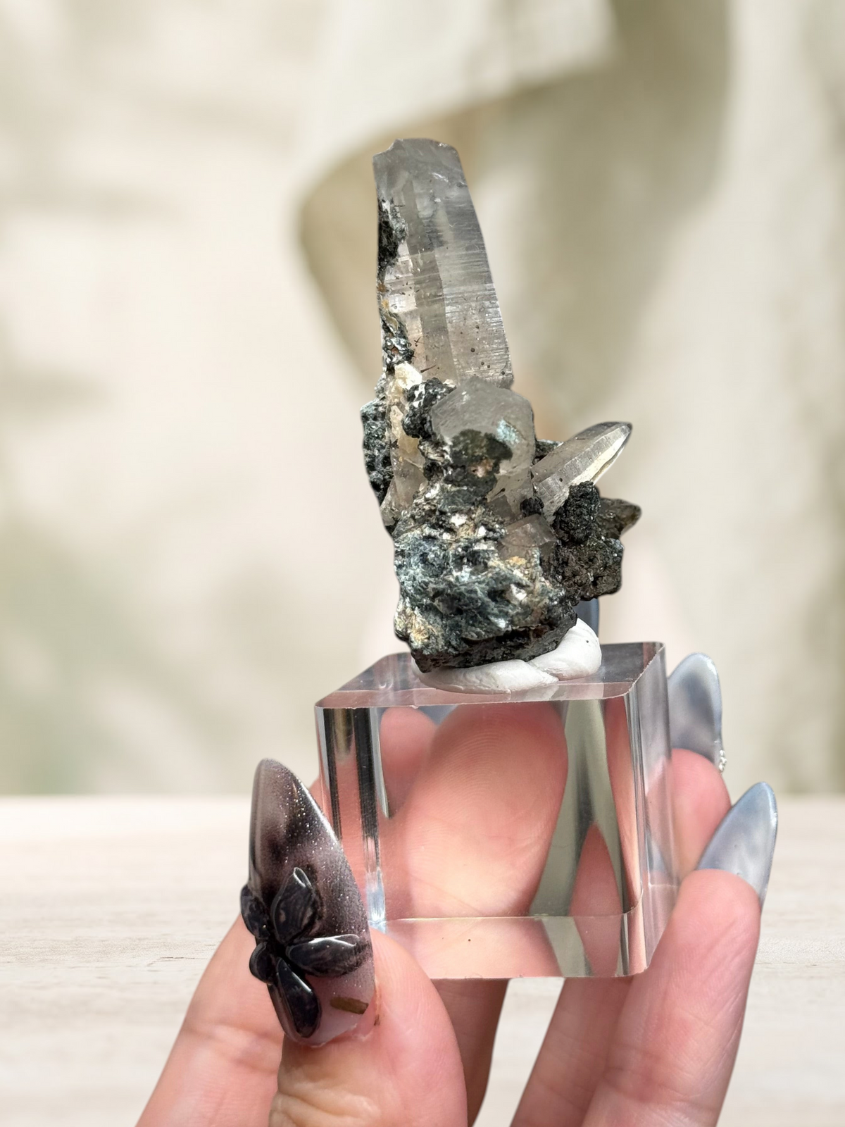 Crystal Glade laser quartz specimen from Pakistan with a slender, tapering crystal point and natural mineral matrix.