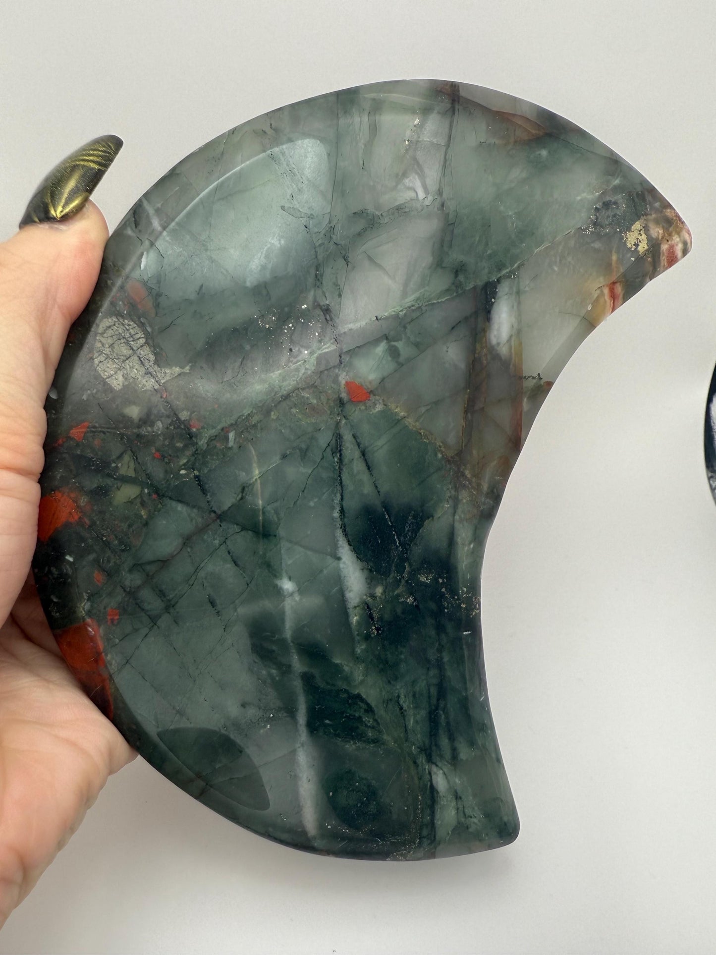 Large African Bloodstone Moon Crystal Carving with Black Stand